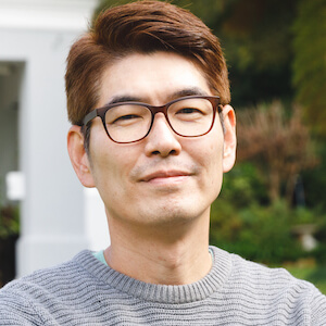 portrait-of-happy-asian-man-wearing-glasses-smilin-2022-01-18-23-46-13-utc (1)